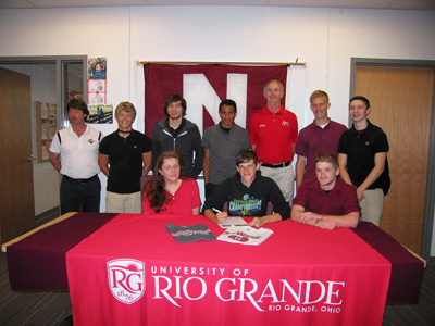 Newark High’s Kameron Carpenter is joined by family, coaches and teammates after signing with Rio